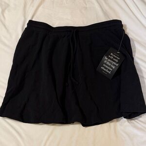 Tuckernuck 	
Black Pique Radley Mini Skirt